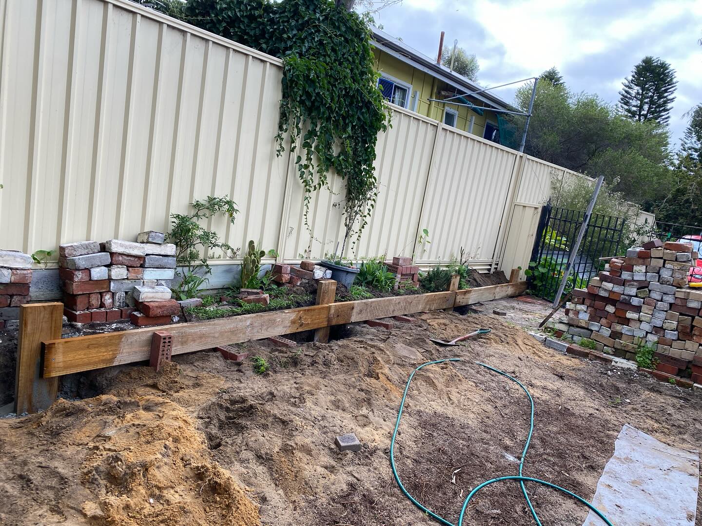 The retaining wall is happening. 👨‍🌾🧑‍🌾